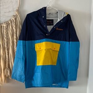Cotopaxi Windbreaker in Navy and Sky Blue with Yellow Accents. Women S/Men XS